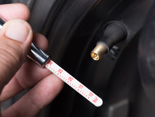 Check the tire pressure with a Tire-Pressure Gauge