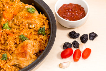 chicken stew stuffed with rice, tomatoes, garlic, prunes, sauce