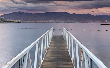 View on the Red Sea and Aqaba gulf from central beach of Eilat - famous resort city in Israel
