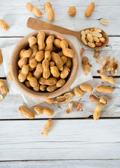 peanuts on wooden surface