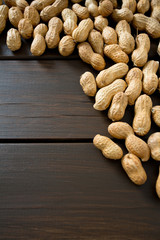 peanuts on wooden surface