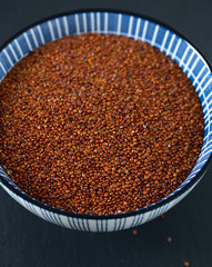 red quinoa on dark background