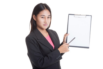 Unhappy Asian business woman point to clipboard with pen  isolated on white background