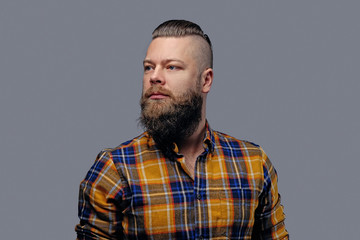 Obraz premium Portrait of a bearded male with punk hairstyle.