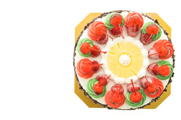 Ice cream cake with christmas theme and cheery on top