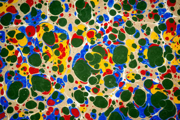 Ebru art. Traditional Turkish Ebru technique. Painting on water, followed by paper prints. Color paint ebru with waves and tile pattern.