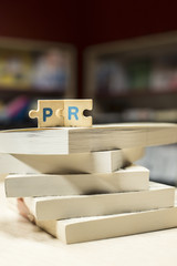 PR letters. Word PR on books in bookstore.