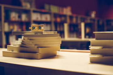 PR letters. Word PR on books in bookstore.