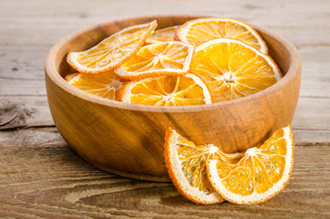 wooden bowl with dry orange