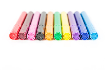 Rainbow colored pack of markers isolated on white background