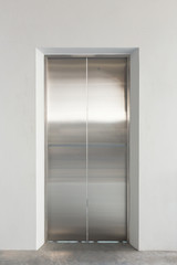 Elevator door or steel door inside office building.