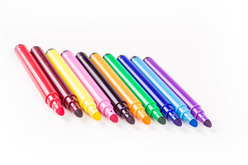 Rainbow colored pack of markers isolated on white background