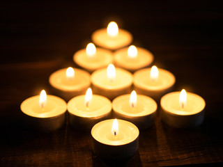 Fototapeta na wymiar fir-tree shape from candle light