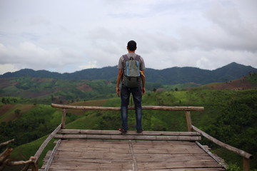 Man standing on the point of view of the mountains at Nan, Thailand