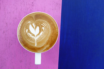 cup of latte art coffee for background