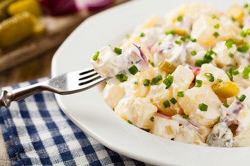 Traditional German potato salad with cucumber, onion and mayonna