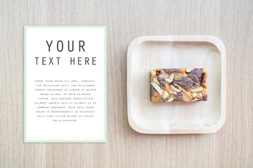 Dark chocolate brownies on wooden background.Copy-space at the left. You can input text that you want. Easy remove text.