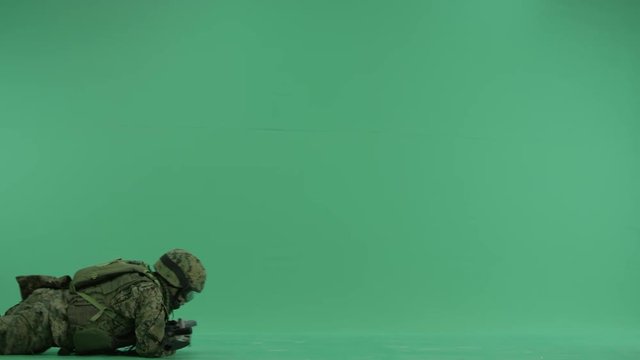 Soldier creeping at green screen