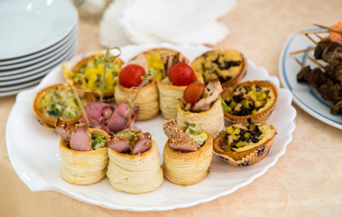 Delicious snacks at the reception. Buffet catering