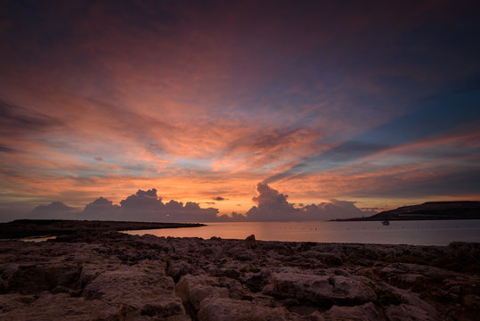Fototapeta Malta sunrise at St.Paul's bay. Amazing seascape with colorful sky