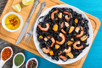 delicious squid ink black noodles with king prawns and mussels