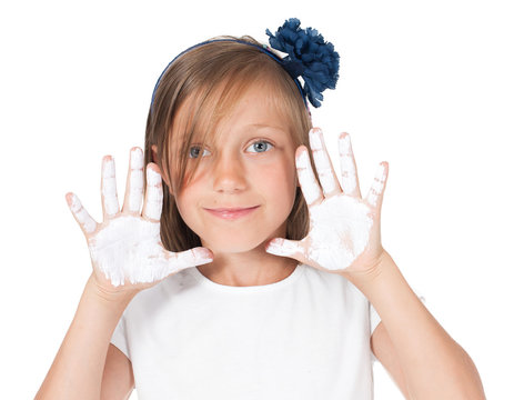 girl shows painted white hands, palms. Fun, creativity, painting.