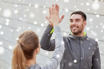 happy couple giving high five outdoors