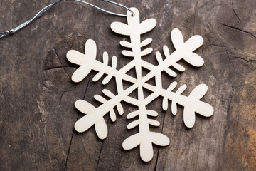 Wooden christmas decoration on brown background