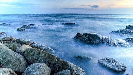 Fototapeta na wymiar Rock in the ocean (long exposure picture)