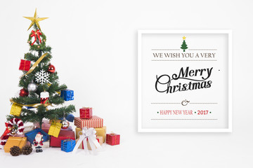 Naklejka na ściany i meble Christmas decorative with gift box and snowflake on christmas tree and Merry Christmas and Happy New Year 2017 text on white background.