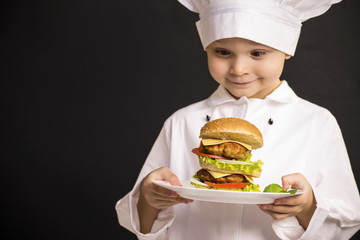 funny boy chef cooked hamburger