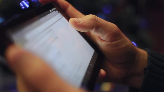 Man hand using tablet on christmas 