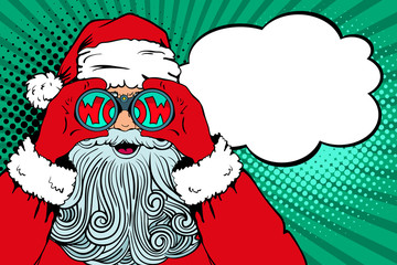 Wow pop art Santa Claus with open mouth holding binoculars in his hands with inscription wow in reflection and speech bubble. Vector illustration in retro pop art comic style. Christmas invitation. - 128963098
