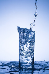 Water in a glass on acrylic background