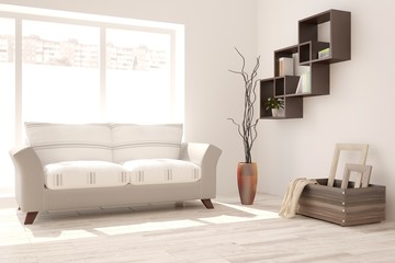 White room with sofa and urban landscape in window. Scandinavian interior design
