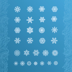 Set of white snowflakes on a blue background.