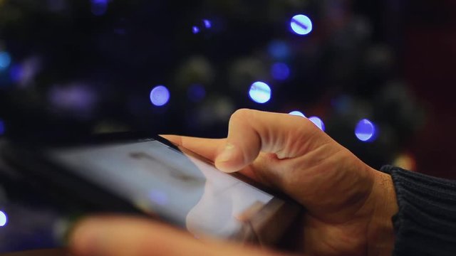 Man hand using tablet on christmas 