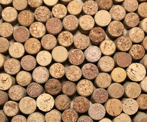 many different wine corks in the background