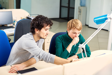 Obraz premium The concept of office work. Business woman thinking behind computer. Emotions, Success, discussion.