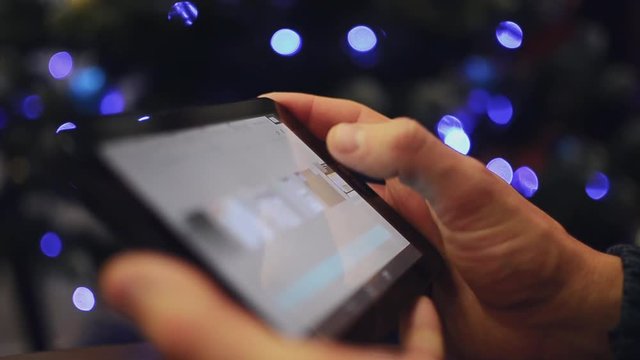 Man hand using tablet on christmas 