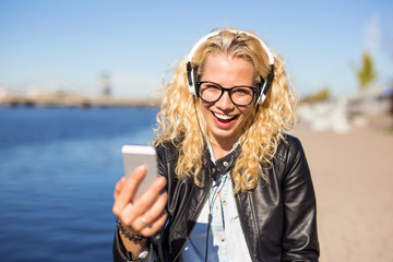 woman listening to music on her smartphone