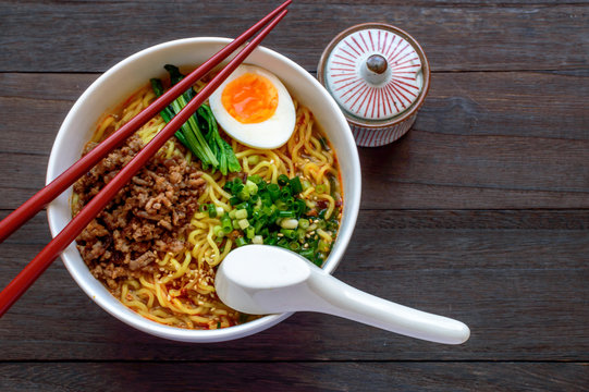 Dan dan, or tan tan noodles are a noodle dish originating from Chinese Sichuan cuisine. It consists of wheat noodles in spicy soup topped with seasoned ground pork.