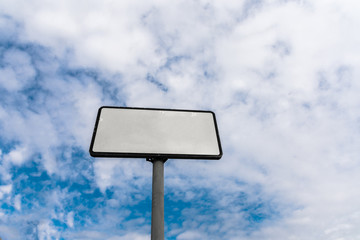 blank road sign on background sky