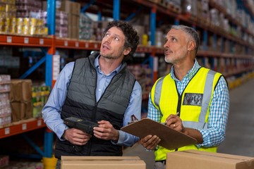 Warehouse workers checking the inventory
