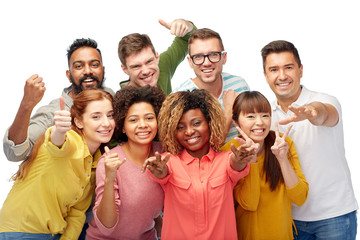 international group of people showing thumbs up