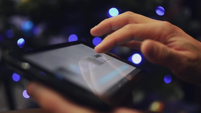 Man hand using tablet on christmas 