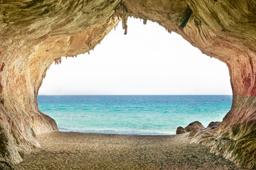 Fototapety  Big empty cave with entrance to sea