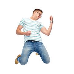 happy man jumping and playing imaginary guitar