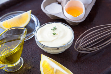 Fresh homemade white sauce Mayonnaise and ingredients eggs, lemo