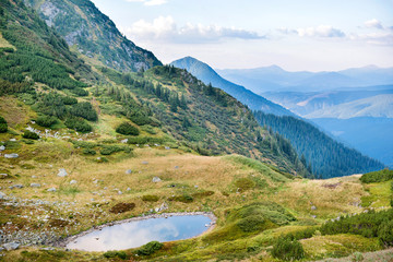 Fototapeta na wymiar Blue lake in the mountains